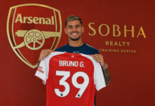 Arsenal anuncia Bruno Guimarães e reforça meio-campo para defender o título da Premier League Bruno Guimarães veste a camisa do Arsenal após ser anunciado como reforço para a temporada 2026/27.